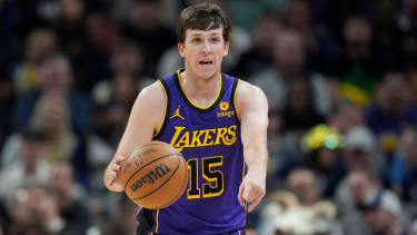 Los Angeles Lakers' Austin Reaves dribbles during the first half of an NBA basketball game against the Indiana Pacers, Friday, March 29, 2024, in Indianapolis. (AP Photo/Darron Cummings)