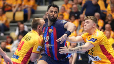 Barcelona's Timothey NGuessan (C) vies during the EHF Champions League quarter-final match between GOG Gudme and Barcelona in Odense, Denmark, on May 11, 2023. (Photo by Mads Claus Rasmussen / Ritzau Scanpix / AFP) / Denmark OUT (Photo by MADS CLAUS RASMUSSEN/Ritzau Scanpix/AFP via Getty Images)