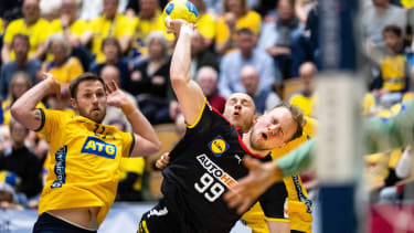 230427 Luca Witzke of Germany and Albin Lagergren of Sweden during the EHF Euro Cup handball match b