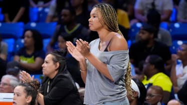 Dallas Wings' Satou Sabally watches play against the Minnesota Lynx in a WNBA basketball game in Arlington, Texas, Thursday, June 27, 2024. (AP Photo/Tony Gutierrez)