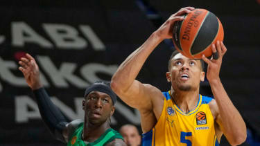 Maccabi's Wade Baldwin IV, right, drives to the basket as Panathinaikos' Kendrick Nunn tries to block him during the Euroleague basketball match between Maccabi Tel Aviv and Panathinaikos in Belgrade, Serbia, Thursday, May 2, 2024. (AP Photo/Darko Vojinovic)