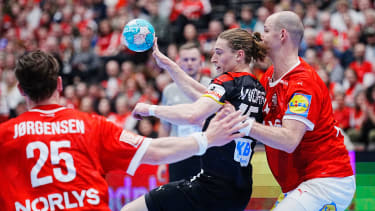 Germanys Juri Knorr between Denmarks Lukas Jorgensen and Simon Hald during the EHF Euro Cup Mens Handball match between Denmark and Germany in Aalborg, Denmark, Thursday March 9, 2023