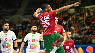 Portugal's right back Joaquim Nazare attempts to score during the men's Handball Olympic qualifying match between Portugal and Tunisia in Tatabanya, Hungary on March 16, 2024. (Photo by ATTILA KISBENEDEK / AFP) (Photo by ATTILA KISBENEDEK/AFP via Getty Images)