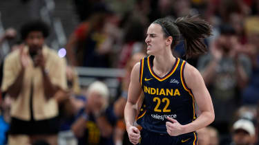 Indiana Fever's Caitlin Clark reacts during the second half of a WNBA basketball game against the Seattle Storm, Sunday, Aug. 18, 2024, in Indianapolis. (AP Photo/Darron Cummings)